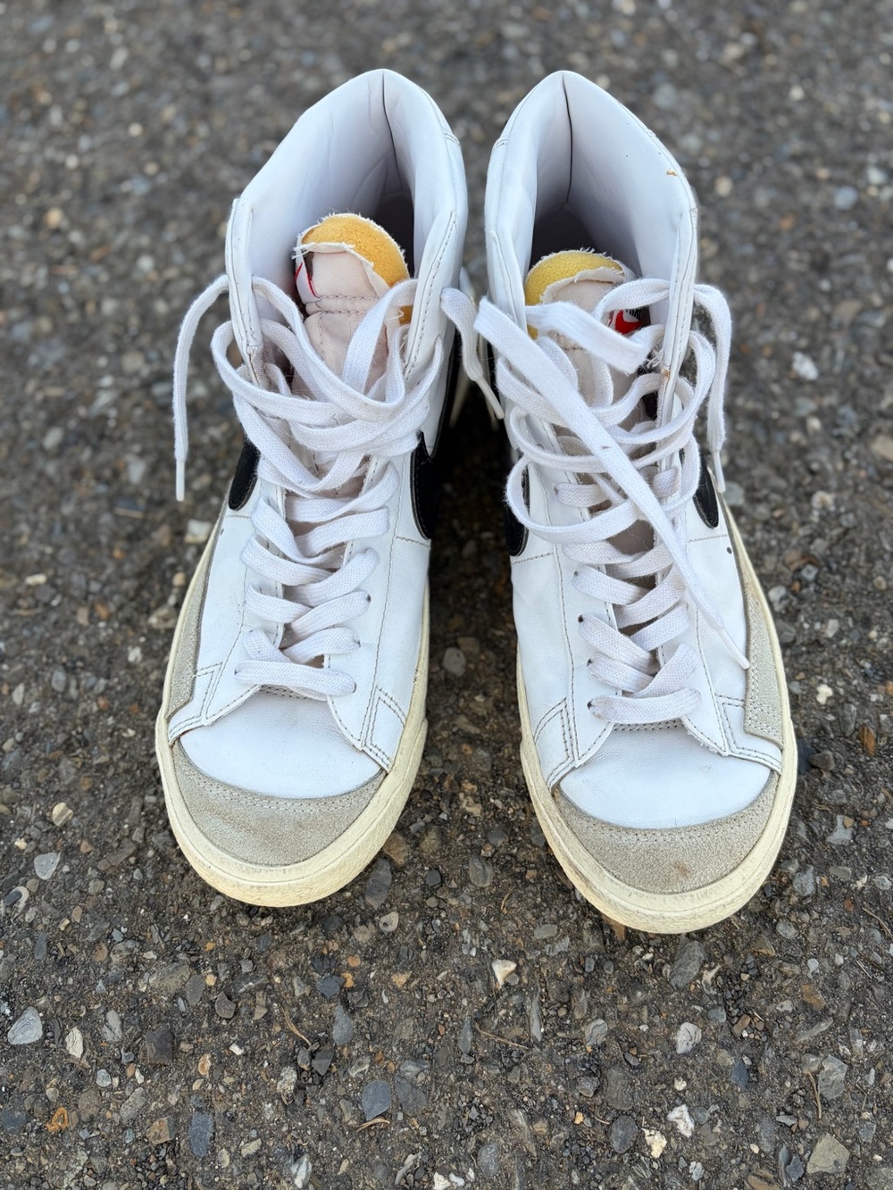Nike White High-Top Sneakers with Black Swoosh and Yellow Tongue